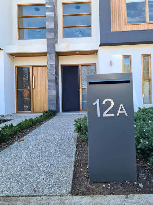 modern pillar letterbox in front of house 12a