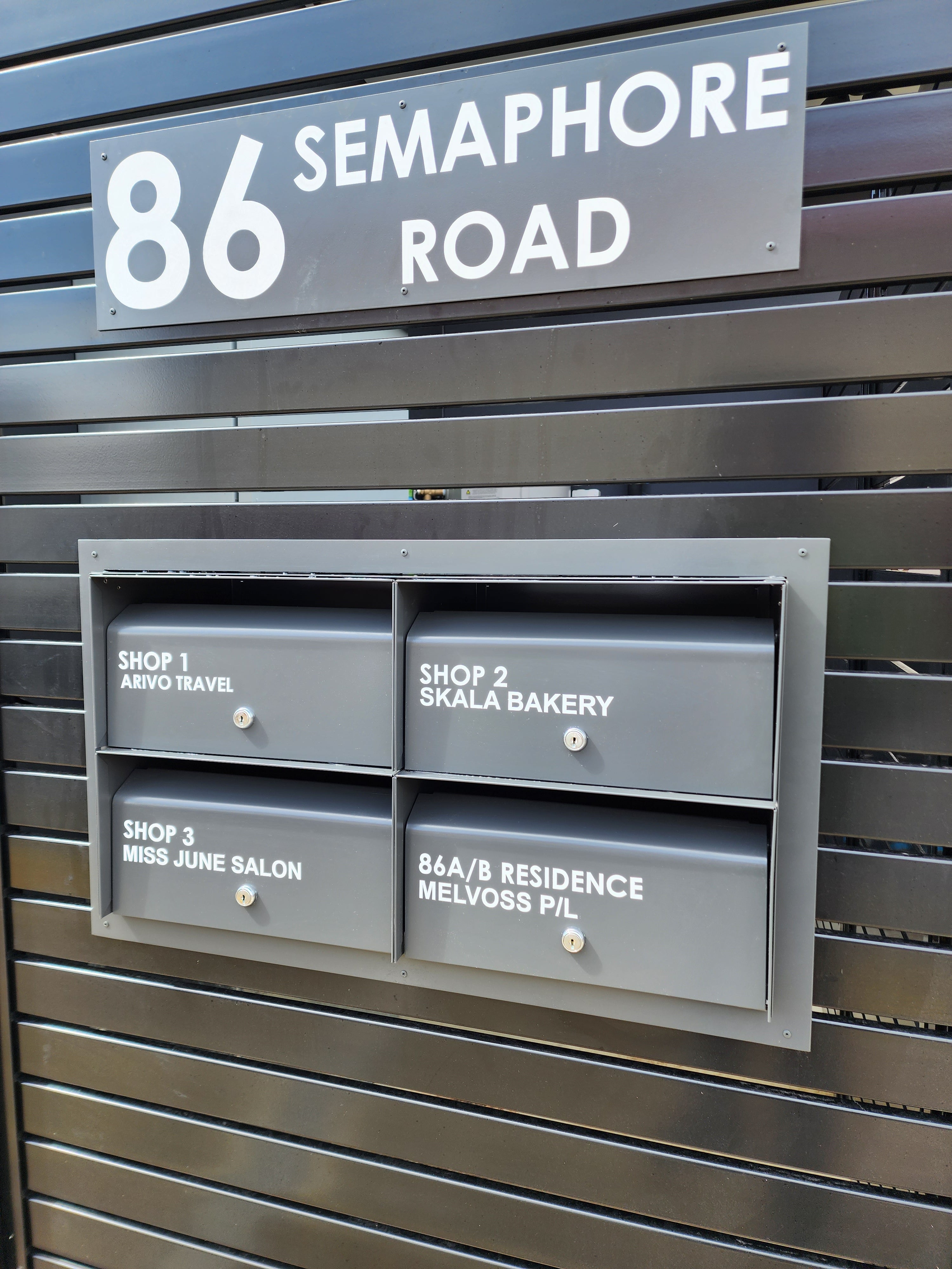 multibank letterboxes through fence