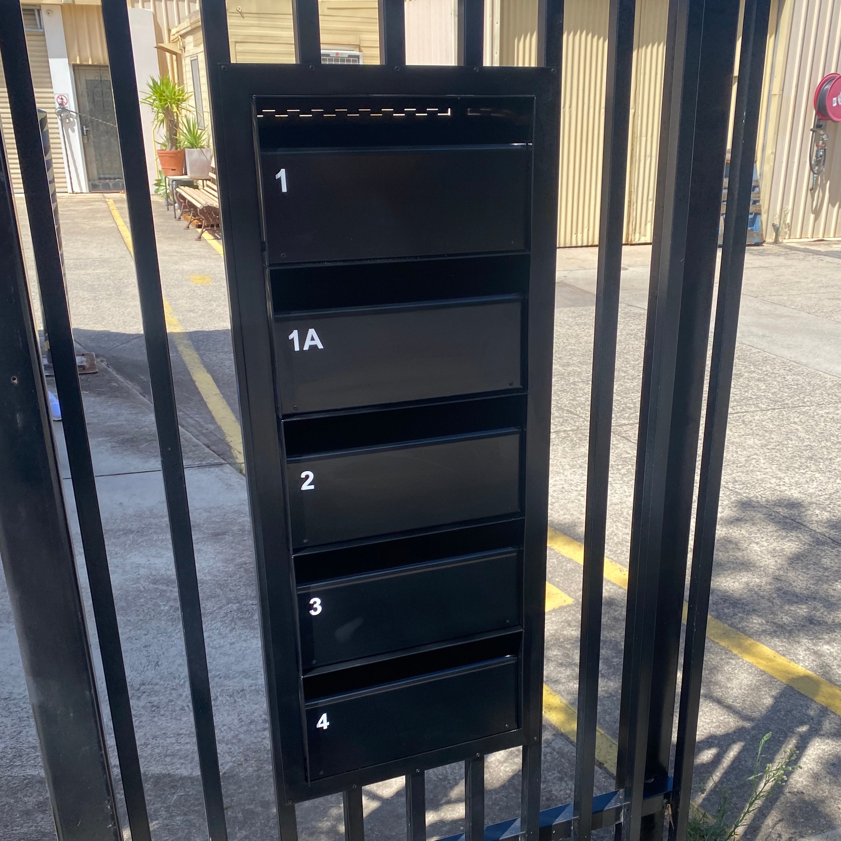 multibank letterboxes through fence rear opening