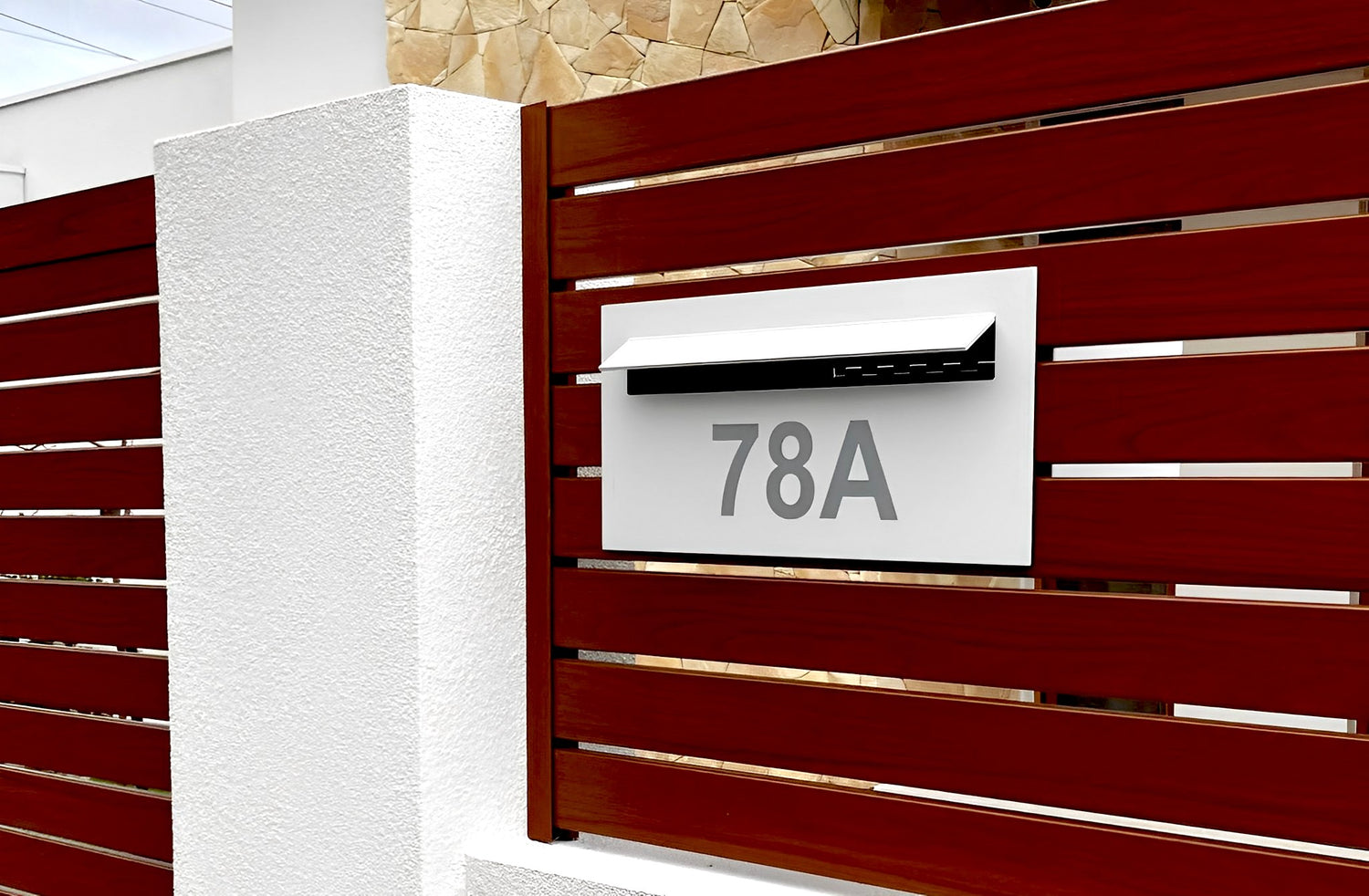 superior letterbox in metal slat fence